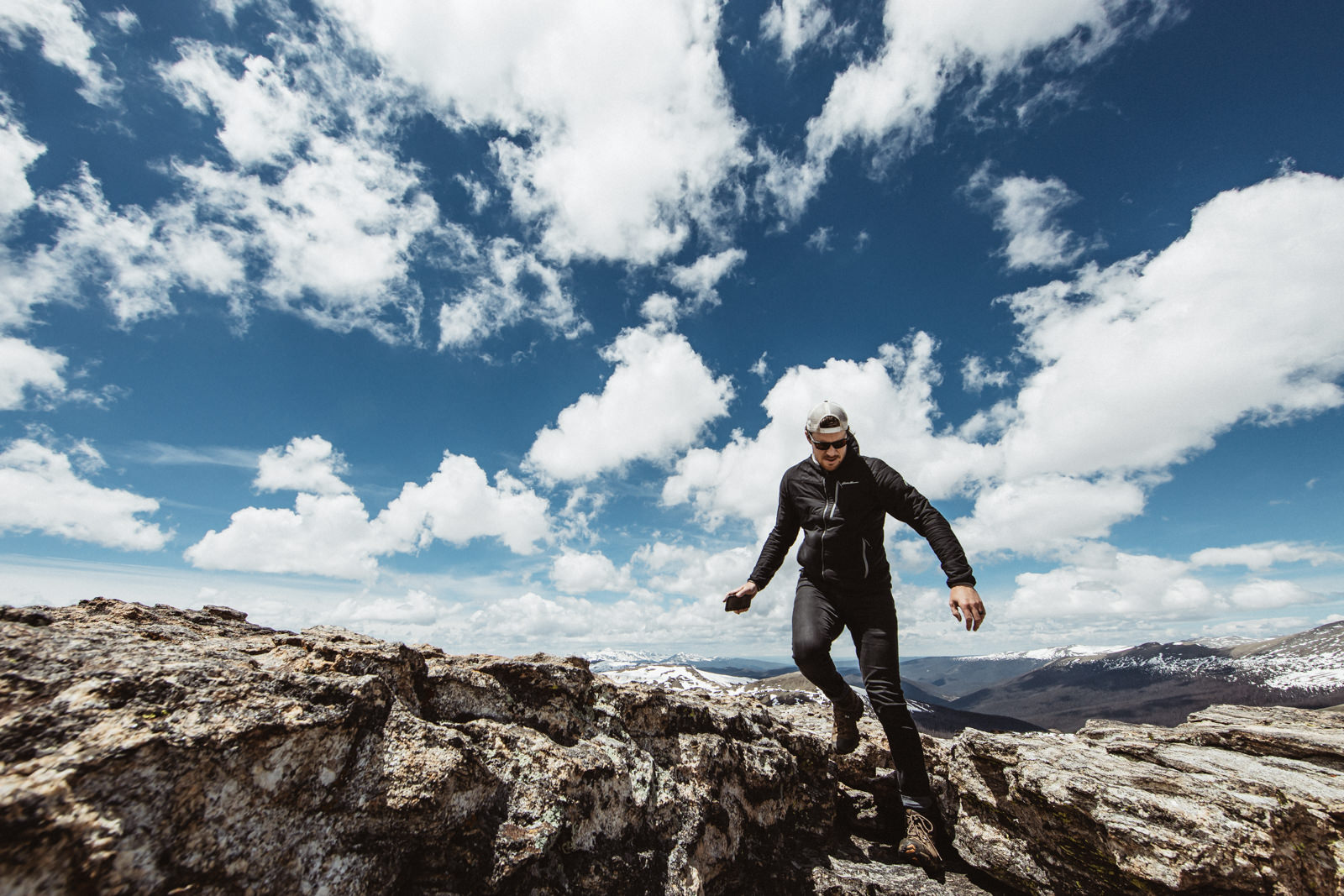 man walking on high mountain trail Adventure Photography by Carrs and Co Photography